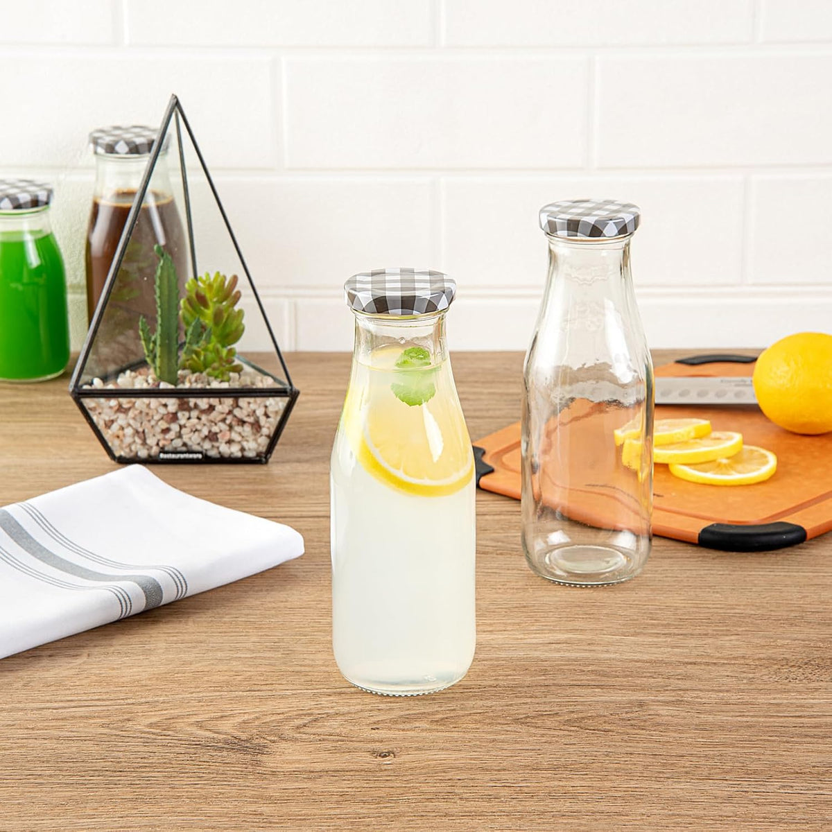 Restaurantware French Countryside 15 Ounce Glass Bottles 10 Durable Juice Bottles - With Black Plaid Lid Dishwashable Clear Glass Countryside Bottles For Hot And Cold Beverages