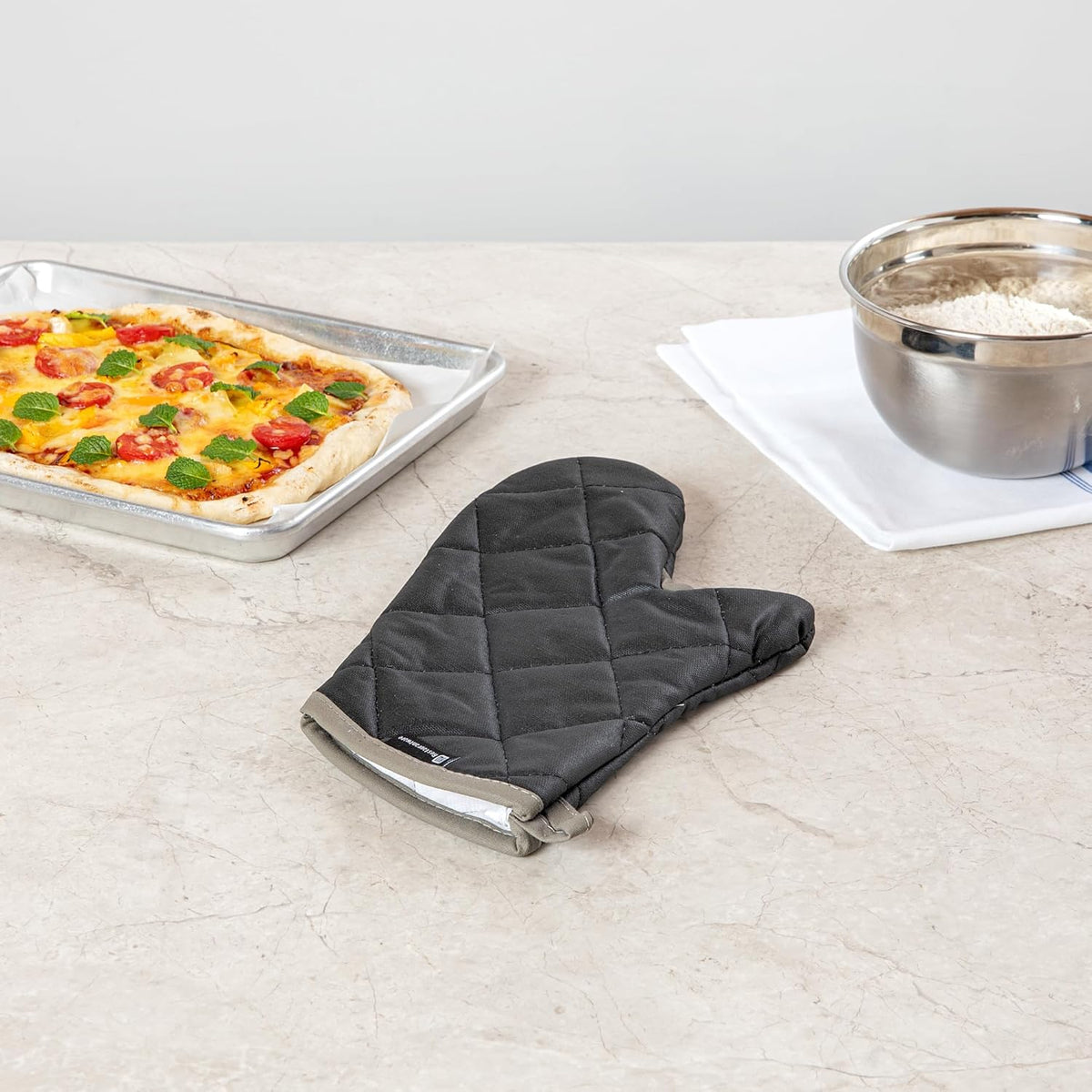 Restaurantware 13.7 x 8 Inch Heavy-Duty Oven Mitt 1 Flame Retardant Heat-Resistant Kitchen Glove - With Thumb Guard Hanging Loop Black Cotton Quilted Glove Heat-Resistant For Cooking And Baking
