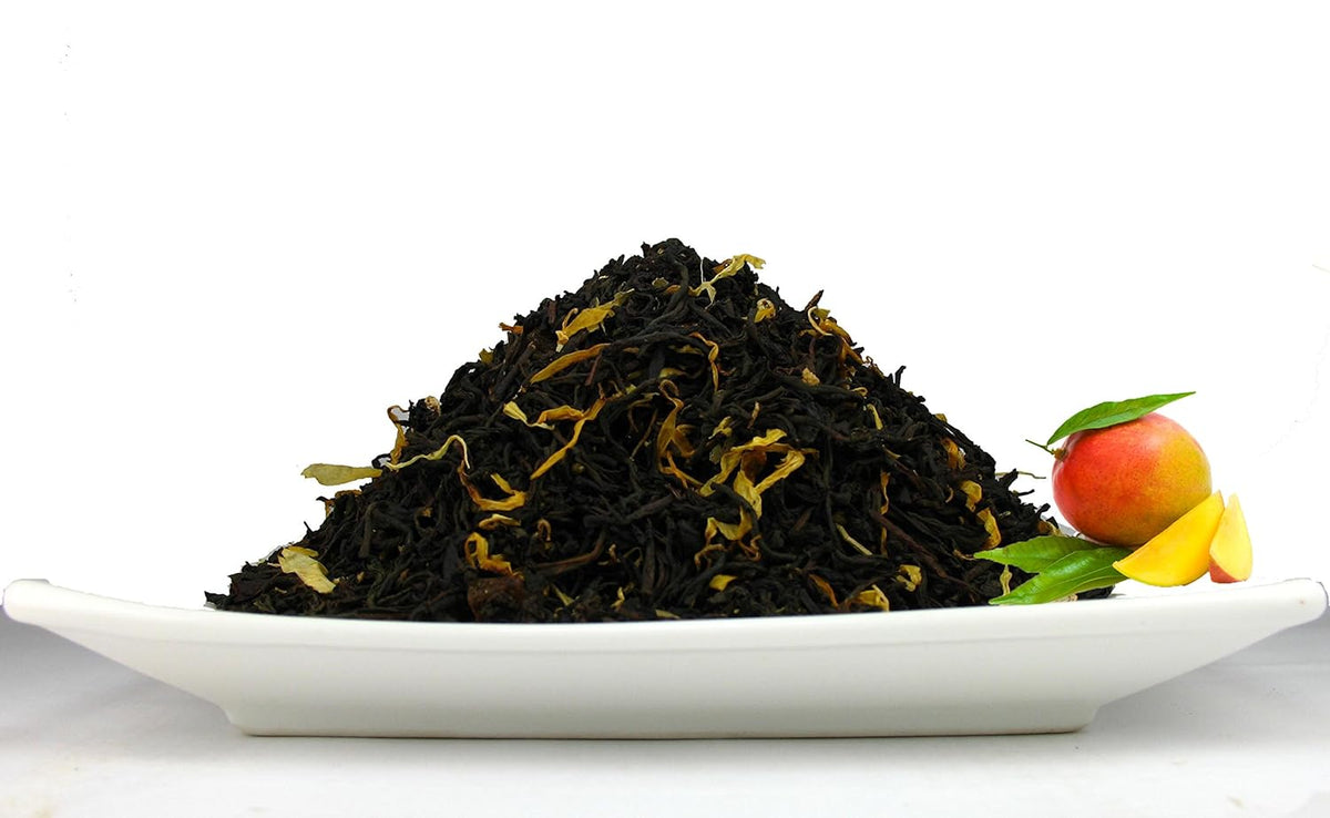 Organic Mango Tea, An Assam Black tea that has aromatic mango bits and natural flavours โ2.80 OZ Tea Tin