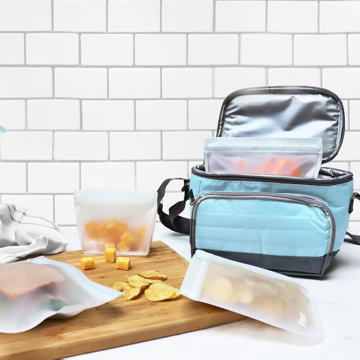 (re) zip 4-Piece Reusable Food Storage Bag Kit – Leakproof, Airtight, BPA-Free, Food-Safe PEVA – Freezer Safe & Travel Friendly – Includes 1 Gallon, 2 Sandwich & 1 Snack Bag