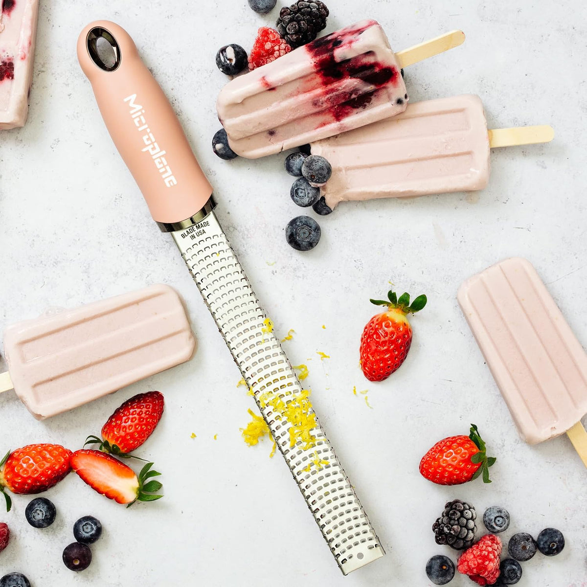 Microplane Zester Grater in Dusty Rose for Citrus Fruits, Hard Cheese, Ginger, Chocolate and Nutmeg with Fine Stainless Steel Blade - Made in USA