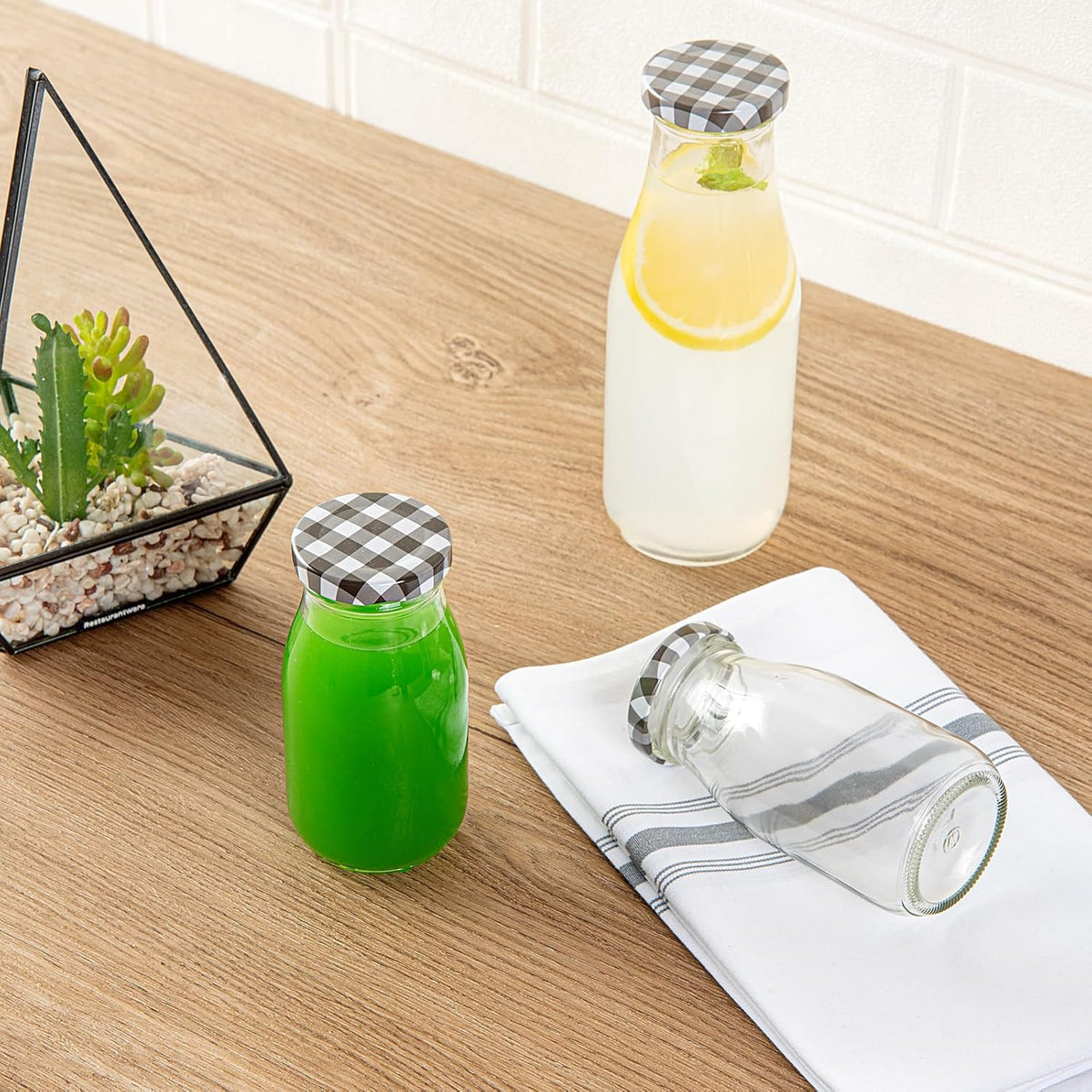 Restaurantware-French Countryside 6 Ounce Glass Bottles, 10 Durable Juice Bottles - With Black Plaid Lid, Dishwashable, Clear Glass Countryside Bottle, For Hot And Cold Beverages